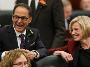 President of Treasury Board and Minister of Finance Joe Ceci (left) and Premier Rachel Notley (right) are seen before the Speech From The Throne was read on the floor of the Alberta Legislature by Lt.-Gov. Lois Mitchell in Edmonton, Alta., on Monday June 15, 2015. The Speech From The Throne marks the beginning of the 29th Legislature. Ian Kucerak/Edmonton Sun/Postmedia Network
