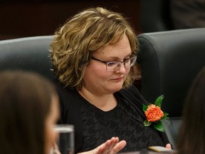 Sarah Hoffman, Minister of Health and Minister of Seniors, pounds her desk during the Speech From The Throne read on the floor of the Alberta Legislature by Lt.-Gov. Lois Mitchell in Edmonton, Alta., on Monday June 15, 2015. The Speech From The Throne marks the beginning of the 29th Legislature. Ian Kucerak/Edmonton Sun/Postmedia Network