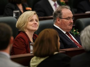 Premier Rachel Notley (left) and Minister of Infrastructure and Minister of Transportation Brian Mason are seen during the Speech From The Throne read on the floor of the Alberta Legislature by Lt.-Gov. Lois Mitchell in Edmonton, Alta., on Monday June 15, 2015. The Speech From The Throne marks the beginning of the 29th Legislature. Ian Kucerak/Edmonton Sun/Postmedia Network
