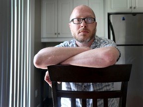 Afghanistan veteran Captain Scott Costen (retired) poses for a photo in his home in Ottawa Monday June 15, 2015. Costen waited five months to get his military pension and health benefits from Veterans Affairs.  Tony Caldwell/Ottawa Sun/Postmedia Network