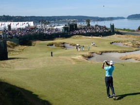 Tiger Woods hits from the fairway on the 17th hole during practice yesterday for this week’s U.S. Open at Chambers Bay. (USA Today Sports)