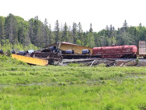 Greater Sudbury Fire Services monitored a train derailment near Municipal Road 4 and Bay Street, about four km west of Whitefish in Greater Sudbury, Ont. on Saturday June 13, 2015. About 15 belonging to Huron Central Railway derailed. John Lappa/Sudbury Star/Postmedia Network