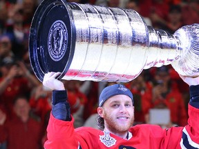 Chicago Blackhawks right winger Patrick Kane hoists the Stanley Cup after defeating the Tampa Bay Lightning in game six of the 2015 Stanley Cup Final at United Center. (Dennis Wierzbicki-USA TODAY Sports)