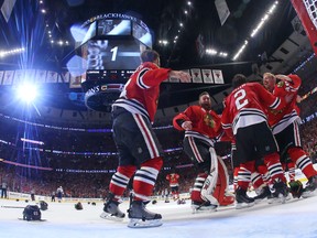Jun 15, 2015; Chicago, IL, USA; Chicago Blackhawks players celebrate after defeating the Tampa Bay Lightning in game six of the 2015 Stanley Cup Final at United Center. Mandatory Credit: Bruce Bennett/Pool Photo via USA TODAY Sports