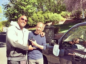 Dwayne "The Rock" Johnson poses with a fan after the actor sideswiped his car. (Instagram)