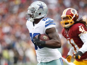 Dallas Cowboys wide receiver Dez Bryant (88) carries the ball to score a touchdown in front of Washington Redskins strong safety Phillip Thomas (41) in the second quarter at FedEx Field. (Geoff Burke-USA TODAY Sports)