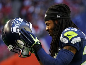 Richard Sherman #25 of the Seattle Seahawks warms up prior to playing in Super Bowl XLIX at University of Phoenix Stadium on February 1, 2015 in Glendale, Arizona. (Christian Petersen/Getty Images/AFP)
== FOR NEWSPAPERS, INTERNET, TELCOS & TELEVISION USE ONLY ==