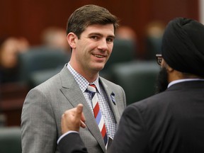 Edmonton Mayor Don Iveson (left) speaks with Calgary-Greenway MLA Manmeet Bhullar before the Speech From The Throne is read at the Alberta Legislature in Edmonton, Alta., on Monday June 15, 2015. The Speech From The Throne marks the beginning of the 29th Legislature. Ian Kucerak/Edmonton Sun