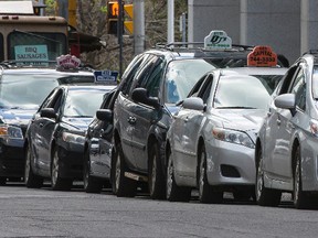 Cabs line up at the taxi stand along Metcalfe Street. Errol McGihon/Postmedia Network