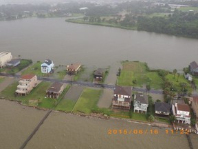 Flooding is pictured from a Coast Guard Air Station Houston MH-65 Dolphin helicopter as it flies over Galveston, Texas after Tropical Storm Bill made landfall in this handout photo provided by the U.S. Coast Guard and taken on June 16, 2015. Tropical Storm Bill hit the Texas coast with strong rains and high winds on Tuesday though no serious injuries were reported, relieving officials and residents just three weeks after floods killed about 30 people in the state. REUTERS/U.S. Coast Guard/Petty Officer 1st Class Brian Bastob/Handout via Reuters