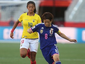 Team Japan midfielder Aya Miyama (r) breaks past Team Ecuador midfielder Kerly Real during FIFA Women’s World Cup play in Winnipeg, Man. Tuesday June 16, 2015.
Brian Donogh/Winnipeg Sun/Postmedia Network