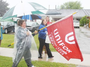 Employees of Maitland Manor braved heavy rains on Friday, June 12 to hold a rally. They have been without a collective agreement since December of last year. (Dave Flaherty/Goderich Signal Star)