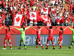 Canada's players salute the crowd after defeating China during the Women's World Cup in Edmonton on Saturday, June 6, 2015. (Perry Mah/Postmedia Network)