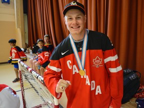 Top NHL draft prospect Lawson Crouse of Mount Brydges shows off the gold medal and ring he won as a member of Canada?s world junior team while taking part in a floor-hockey fundraiser at Colborne St. United Church for the Montessori school his mom runs in London. (MORRIS LAMONT, The London Free Press)