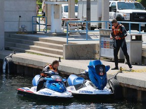 Toronto Police Marine Unit continued their search for the body of Keith White who fell off a cruise ship on Jun 13 in Humber Bay. Two jetskis return from searching on Lake Ontario with no results. on Tuesday June 16, 2015. Michael Peake/Toronto Sun/Postmedia Network