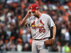 St. Louis Cardinals starting pitcher Adam Wainwright (50) reacts after giving up a two run home run to San Francisco Giants second baseman Joe Panik (not pictured) during the third inning of game five of the 2014 NLCS playoff at AT&T Park. (Kyle Terada-USA TODAY Sports)