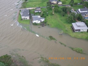 Flooding is pictured from a Coast Guard Air Station Houston MH-65 Dolphin helicopter as it flies over Galveston, Texas after Tropical Storm Bill made landfall in this handout photo provided by the U.S. Coast Guard and taken on June 16, 2015. Tropical Storm Bill hit the Texas coast with strong rains and high winds on Tuesday though no serious injuries were reported, relieving officials and residents just three weeks after floods killed about 30 people in the state. REUTERS/U.S. Coast Guard/Petty Officer 1st Class Brian Bastob/Handout via Reuters