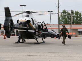Members of the OPP tactical rescue unit at the scene of an armed standoff at the Canadian Tire in Timmins Wednesday afternoon.