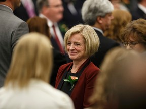 Premier Rachel Notley (left) leaves after the Speech From The Throne with Lt.-Gov. Lois Mitchell on the floor of the Alberta Legislature by in Edmonton, Alta., on Monday June 15, 2015. The Speech From The Throne marks the beginning of the 29th Legislature. Ian Kucerak/Edmonton Sun/Postmedia Network