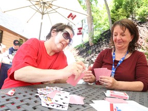 JASON MILLER/THE INTELLIGENCER
Respite worker Louise Evans (right) plays a game of cards with Debbie Sergeant (left), brain injury survivor and one of close to 50 locals catered to by the Pathways to Independence acquired brain injury program.