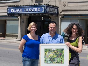 From left, Martha Zimmeran, Rick Kish and Sylvia Langer, holding Curing Pond In August, a painting by Jamelie Hassan, invite all Londoners to the UPwithART fundraiser in support of The Unity Project Saturday at the Palace Theatre. (DEREK RUTTAN, The London Free Press)