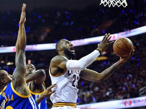 Cleveland Cavaliers forward LeBron James (23) shoots the ball against Golden State Warriors guard Andre Iguodala (9) during the first quarter in game six of the NBA Finals at Quicken Loans Arena. (Bob Donnan-USA TODAY Sports)