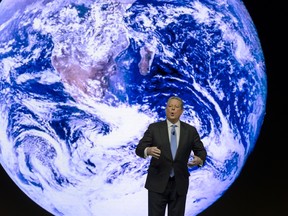 Former US Vice President Al Gore attends a session of the World Economic Forum (WEF) annual meeting on January 21, 2014 in Davos. The world's political and business elite gathered for their annual meeting in the glitzy Swiss ski resort of Davos on January 21, with the shadow of recent attacks in France and ongoing global conflicts looming large.  AFP PHOTO / FABRICE COFFRINI