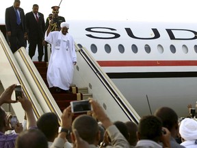 Sudanese President Omar al-Bashir disembarks from the plane, after attending an African Union conference in Johannesburg South Africa, at the airport in the capital Khartoum, Sudan June 15, 2015. Al-Bashir flew out of South Africa on Monday in defiance of a Pretoria court that later said he should have been arrested to face genocide charges at the International Criminal Court. Despite a legal order for him to stay in the country ahead of the ruling on his detention, the government let Bashir leave unhindered, with South Africa's ruling party accusing the ICC of being biased against Africans and "no longer useful".  REUTERS/Mohamed Nureldin Abdallah