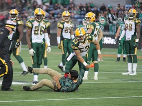 Edmonton Eskimos long snapper Ryan King throws a fan down on the ground in Fort McMurray Alta. on Saturday June 13, 2015. Robert Murray/Fort McMurray Today/Postmedia Network