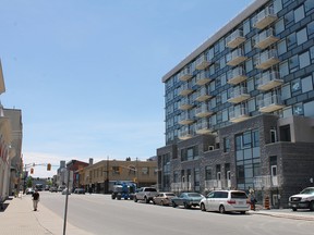 The Anna Lane condominium, set to open this summer, towers over Princess Street from the corner of Queen and Bagot Street. The development is one of many projects in the Downtown Kingston! BIA mandate to intensify residential living downtown. (Jacob Rosen /For The Whig-Standard)