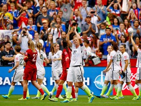 American players acknowledge the crowd after their win over Nigeria in Vancouver Tuesday. (USA TODAY SPORTS)