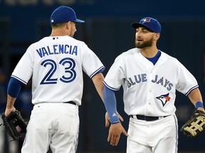 Blue Jays' Kevin Pillar celebrates with third baseman Danny Valencia after their team's 8-0 win over the New York Mets in Toronto. (DAN HAMILTON/USA TODAY SPORTS)