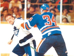 Maple Leafs legend Wendel Clark gets ready to punch Edmonton tough guy Marty McSorley back in the day. (Michael Peake/Sun file)