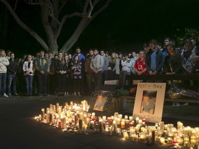 Hundreds of attendees stand in silence during a candlelight vigil for the victims of the Berkeley balcony collapse in Berkeley, California June 17, 2015. Three men and three women in their early 20s, including an American friend of the Irish students, died in the collapse, and seven others were hospitalized. REUTERS/Elijah Nouvelage
