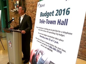 Mayor Jim Watson on Thursday, June 18, 2015 announces a telephone town hall ahead of budget 2016. The town hall will be held Thursday, June 25, 2015. JON WILLING/OTTAWA SUN