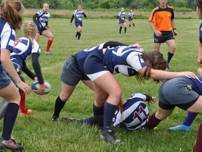 Forwards protect the ball as Lexi Smith is about to pass out of a ruck. (Contributed photo)