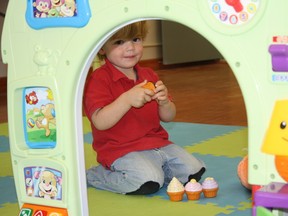 SARAH HYATT/THE INTELLIGENCER
Three-year-old Isaac Ballard hangs out with mom Leanne Ballard at work, at Quinte Parents in Belleville Thursday. Quinte Parents recently donated the play space as shown here, to help a local woman run a monthly support and play group for families dealing with autism.