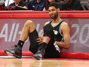 Tim Duncan of the San Antonio Spurs as he sits by the scorer's table waiting to enter the game against the Los Angeles Clippers during Game Seven of the Western Conference quarterfinals of the 2015 NBA Playoffs at Staples Center on May 2, 2015. (Stephen Dunn/Getty Images/AFP)
