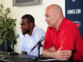 General Manager Danny Ferry of the Atlanta Hawks introduces Paul Millsap as the newest member of the Atlanta Hawks during a press conference on July 10, 2013 at Philips Arena. (Scott Cunningham/NBAE via Getty Images/AFP)