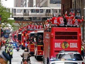 The Chicago Blackhawks parade makes its way east on Monroe during the 2015 Stanley Cup championship parade and rally at Soldier Field on June 18, 2015. (Jon Durr/USA TODAY Sports)