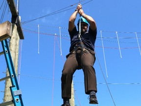 BRUCE BELL/THE INTELLIGENCER
Prince Edward-Hastings MPP Todd Smith drops from one of the stations on the high rope Challenge Course at the Paths of Courage facility on Big Island. The Sexual Assault Centre (SAC) for Quinte and District celebrated a three-year Ontario Trillium Foundation grant of $169,100 on Thursday.
