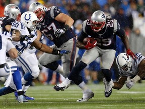 Patriots running back LeGarrette Blount (29) runs the ball against Colts inside linebacker Jerrell Freeman (50) during the AFC Championship Game at Gillette Stadium in Foxborough, Mass., on Jan. 18, 2015. (Greg M. Cooper/USA TODAY Sports)
