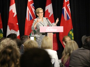 Ontario Premier Kathleen Wynne addresses about 200 business leaders and local dignitaries at a Sarnia Lambton Chamber of Commerce luncheon Thursday, June 18, 2015 in Sarnia, Ont. Wynne spent several hours in the community Thursday morning, visiting the Great Lakes and St. Clair Cities Initiative conference and celebrating a $105-million investment in local industry before heading to the luncheon. (Barbara Simpson/The Observer/Postmedia Network)