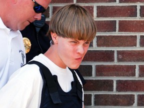 Police lead suspected shooter Dylann Roof, 21, into the courthouse in Shelby, N.C., June 18, 2015. (JASON MICZEK/Reuters)