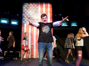 Jack Phoenix plays Johnny in a scene from the Original Kids Theatre Company Alumni production of American Idiot at the Spriet Family Theatre in the Covent Garden. (CRAIG GLOVER, The London Free Press)