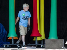 Volunteer stage crew Jamie Hockin sets stage decor in advance of the Ottawa Jazz Festival that runs from June 18-July 1. Thursday June 18, 2015. Errol McGihon/Ottawa Sun/Postmedia Network