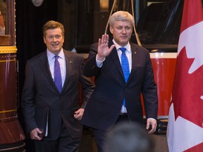 Prime Minister Stephen Harper, right, and Mayor John Tory arrive at press conference at the TTC's Hillcrest Yard on June 18, 2015 announcing $2.6 billion in federal funding for SmartTrack.  June 18, 2015. (Craig Robertson/Toronto Sun)
