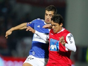 Braga's Mossoro (R) fights for the ball with Feirense's Thiago Freitas during their Portuguese Premier League soccer match at Marcolino de Castro stadium in Santa Maria da Feira  March 17, 2012.  
REUTERS/Jose Manuel Ribeiro (PORTUGAL - Tags: SPORT SOCCER)