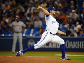 Toronto Blue Jays starting pitcher R.A. Dickey pitches against his former club the New York Mets at Rogers Centre. (Peter Llewellyn-USA TODAY Sports)