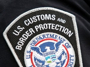 A U.S. Customs and Border Protection badge is seen on the shoulder of a customs agent in this May 26, 2009 file photo. (REUTERS/Rebecca Cook/Files)